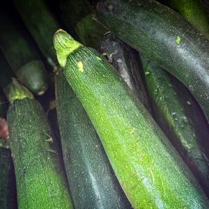 A close-up view of fresh green zucchinis showcasing their vibrant texture.